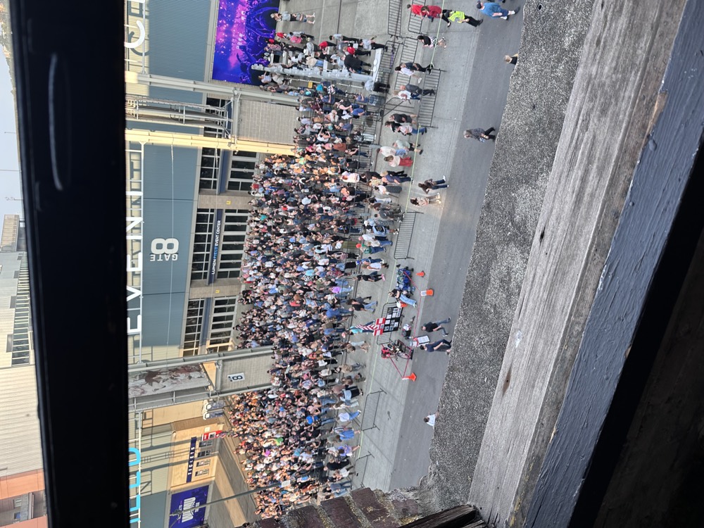 View from the studio window down to the busy street and Lumen Field entrance below