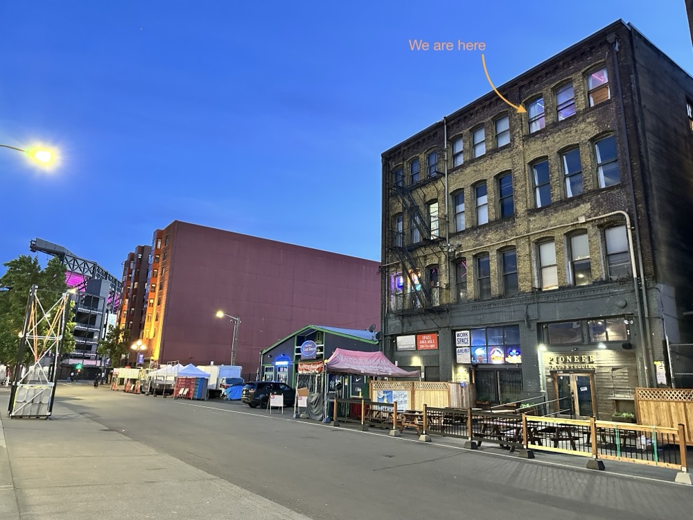 The four-story brick building, with the studio floor marked